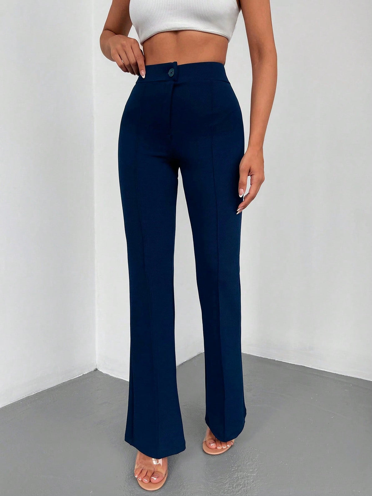 Pantaloni lunghi a svasatura eleganti a vita alta con bottoni e cerniere per le donne