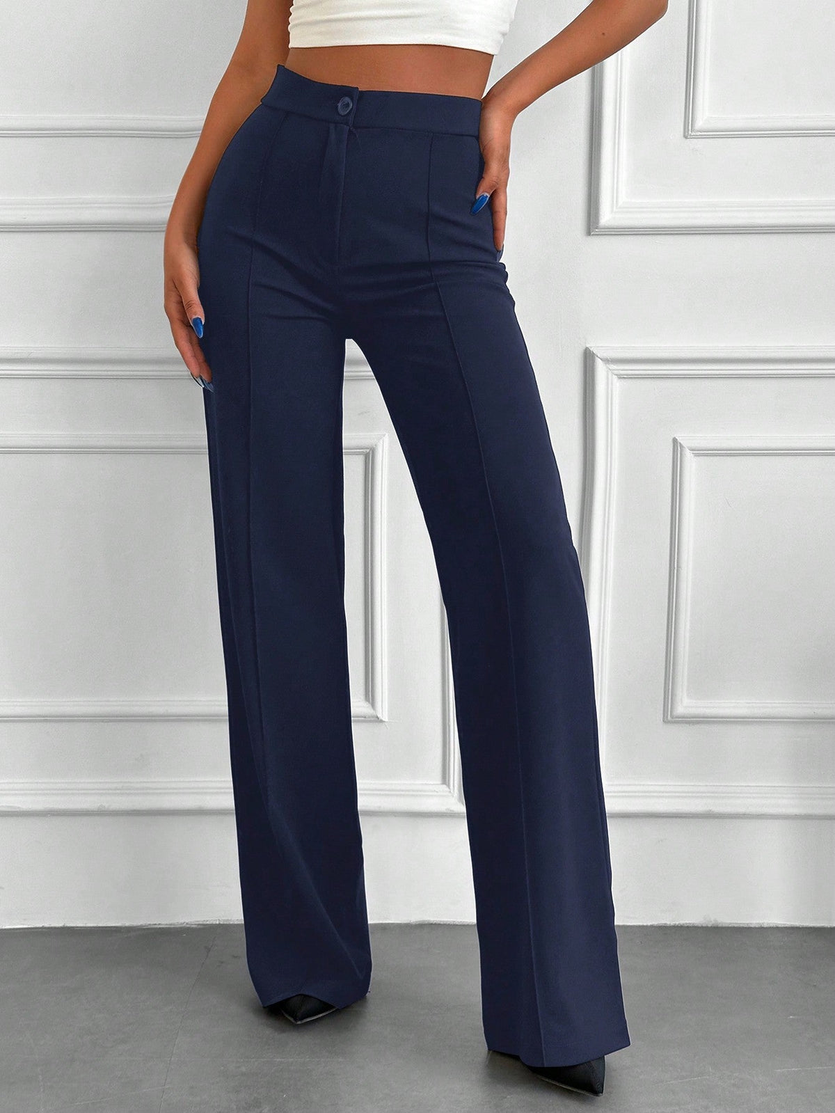 Pantaloni vita alta con bottone frontale