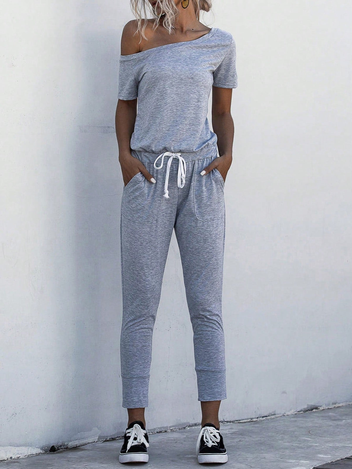 Jumpsuit Maglietta monocolore scollatura asimmetrica con coulisse a vita tasca inclinata