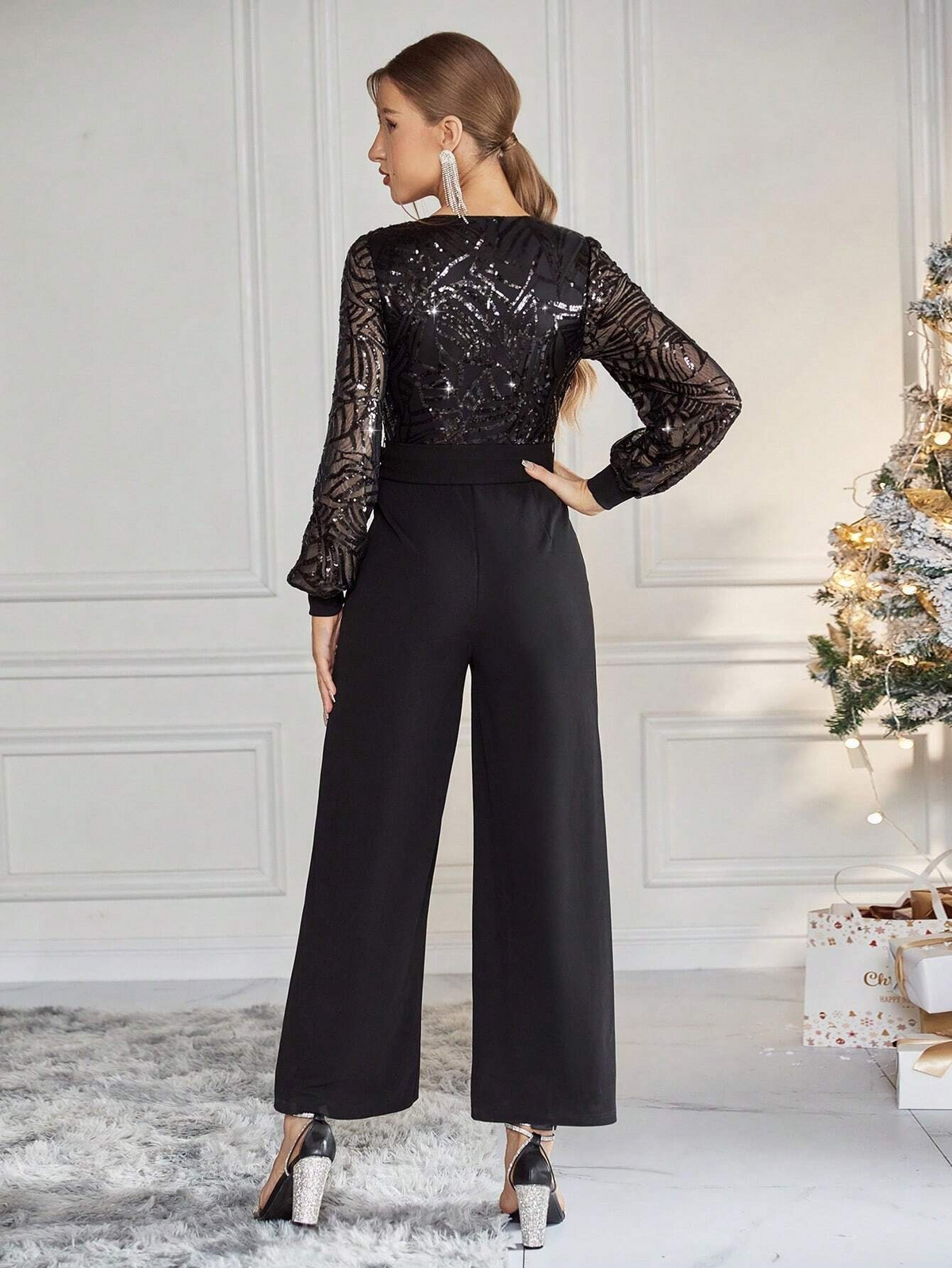 Jumpsuit gamba larga paillette a contrasto manica a lanterna con cintura