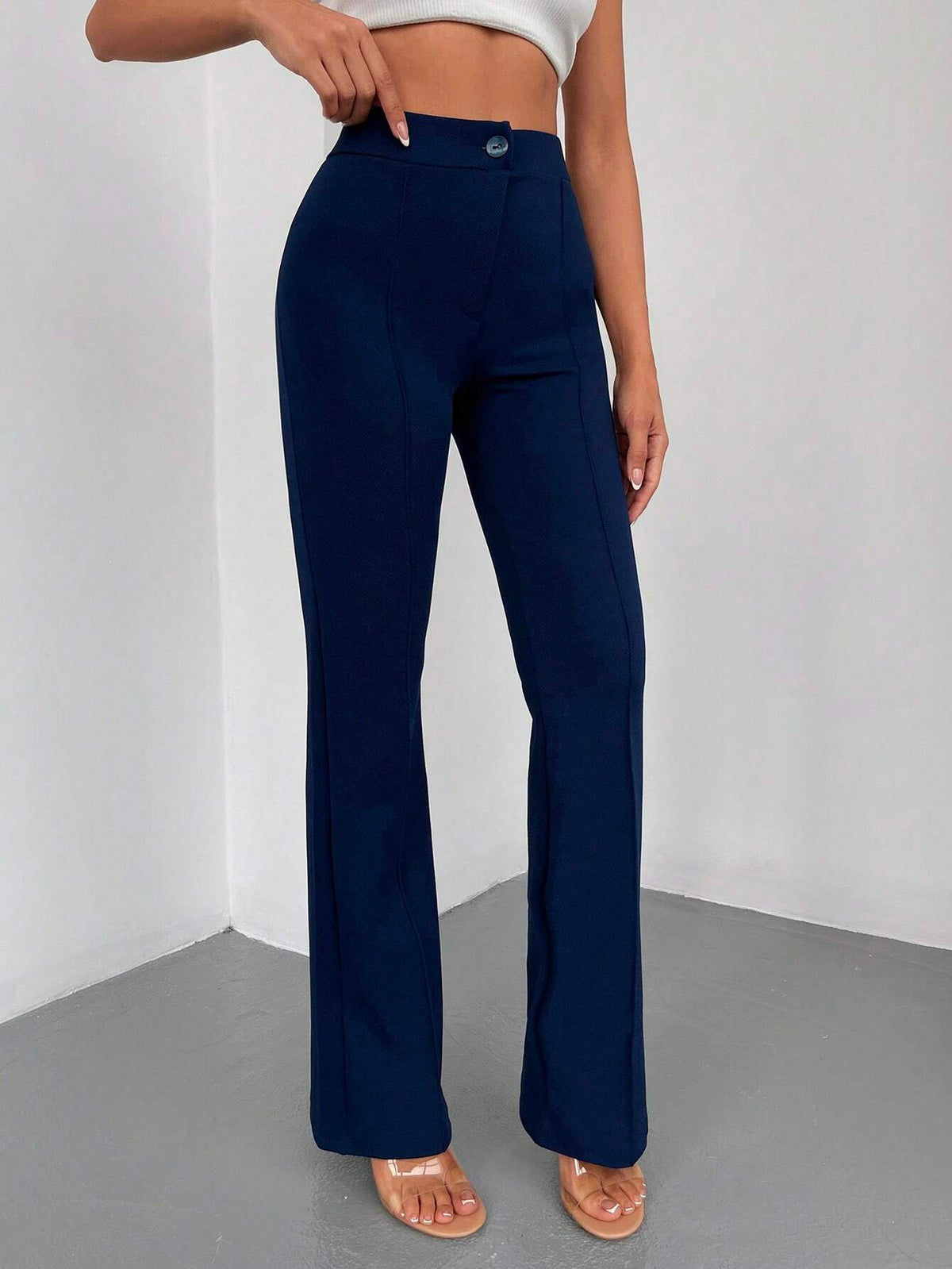 Pantaloni lunghi a svasatura eleganti a vita alta con bottoni e cerniere per le donne