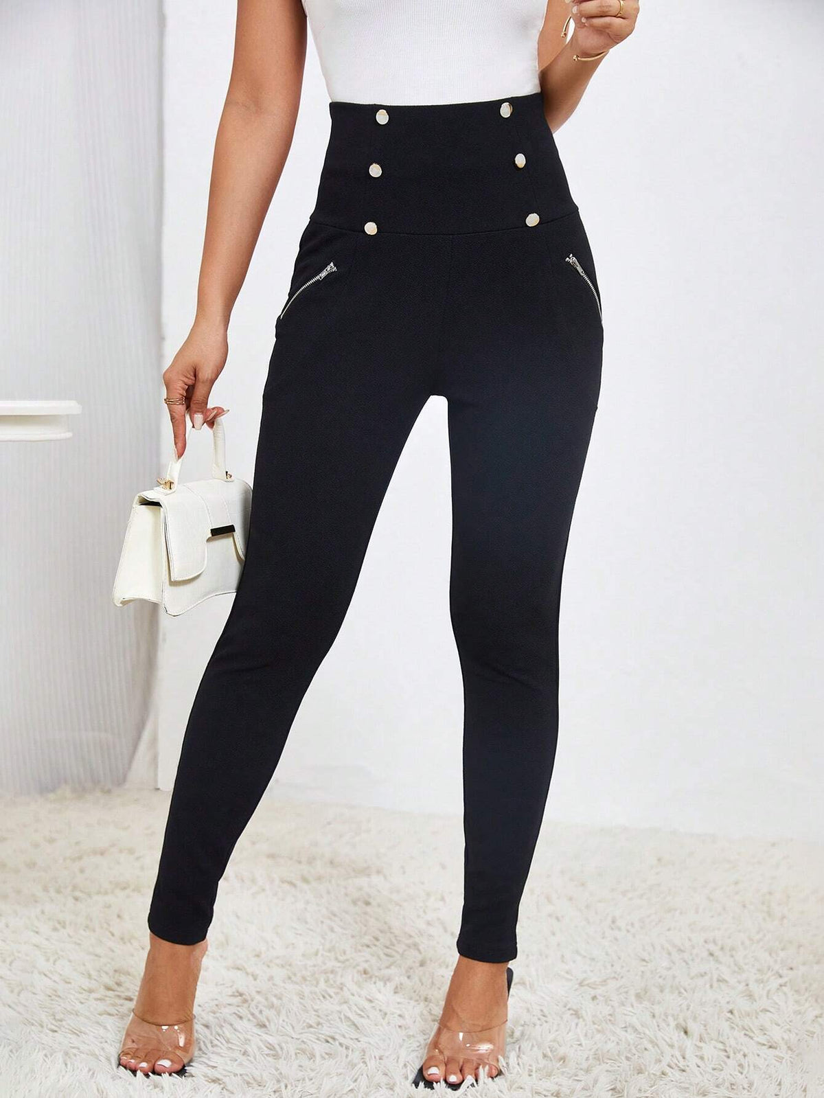 Pantaloni aderente vita alta dettaglio bottone